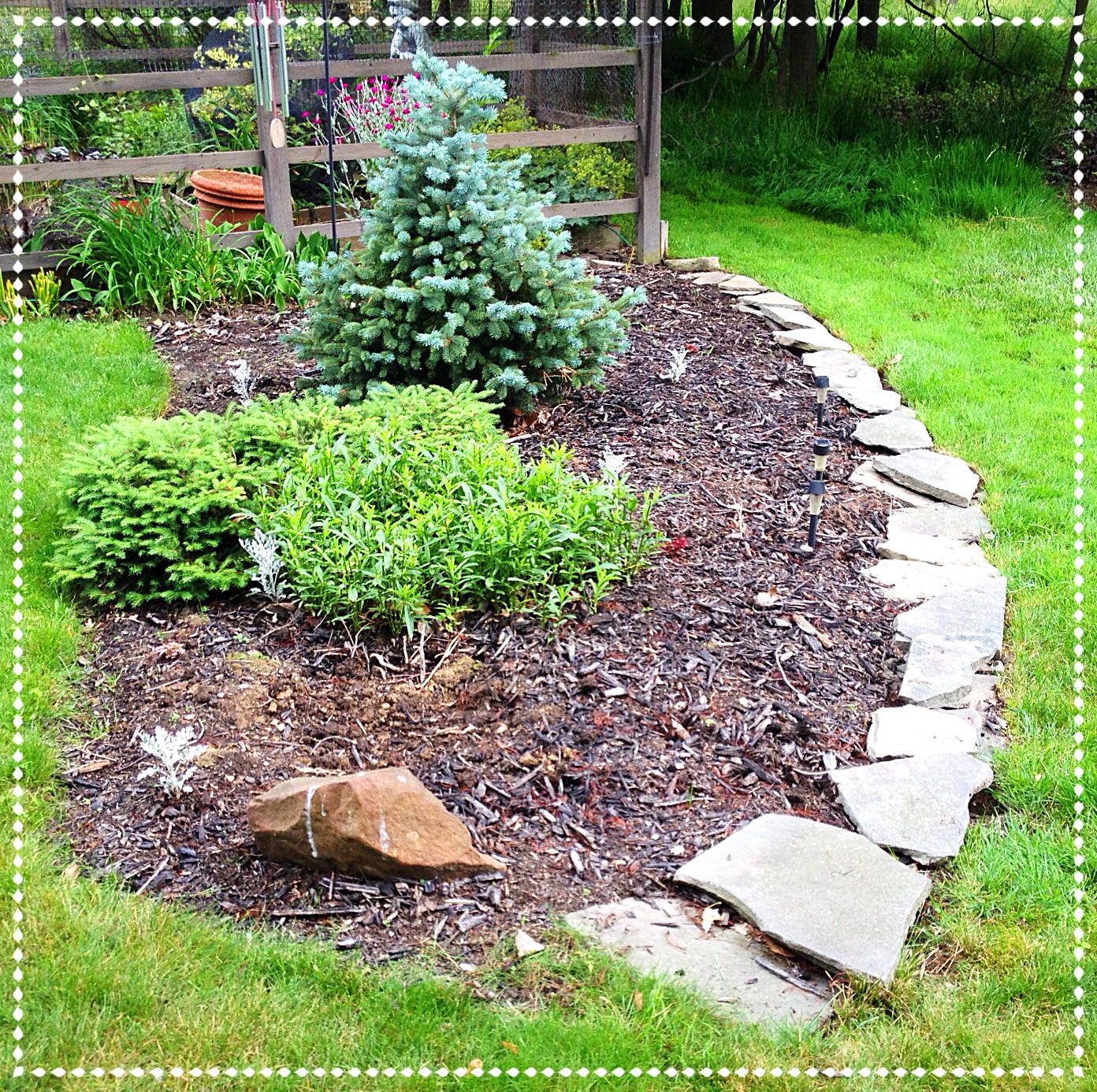 Border is edged half in stone and half with a trough