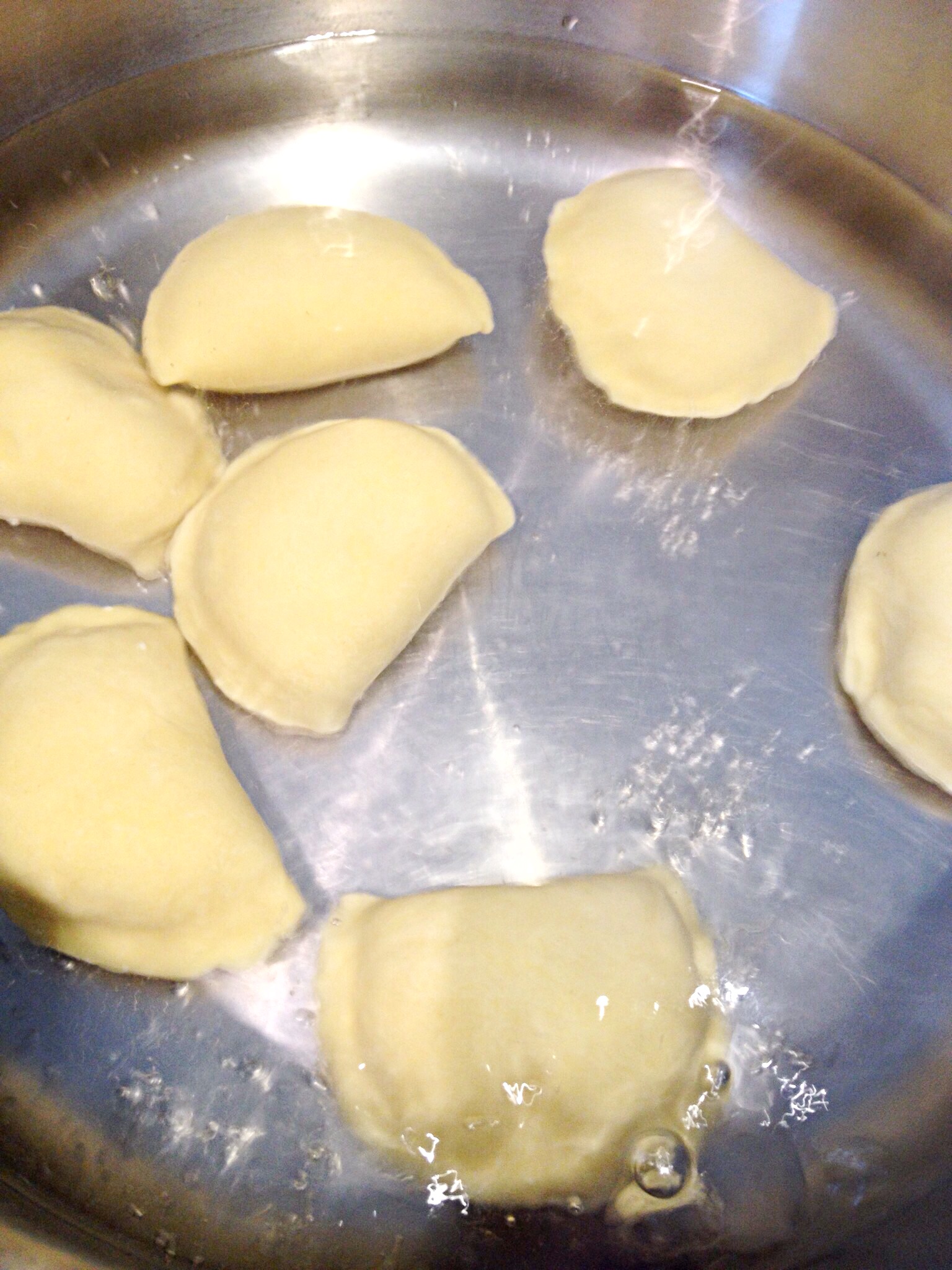 Photo showing boiling a few pierogi at a time for about 3 minutes.
