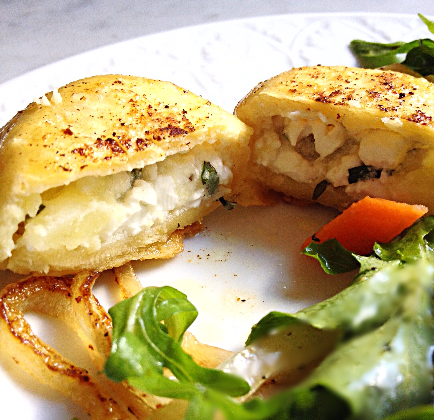 Photo Cheese and Potato Pierogi cut in half to reveal filling