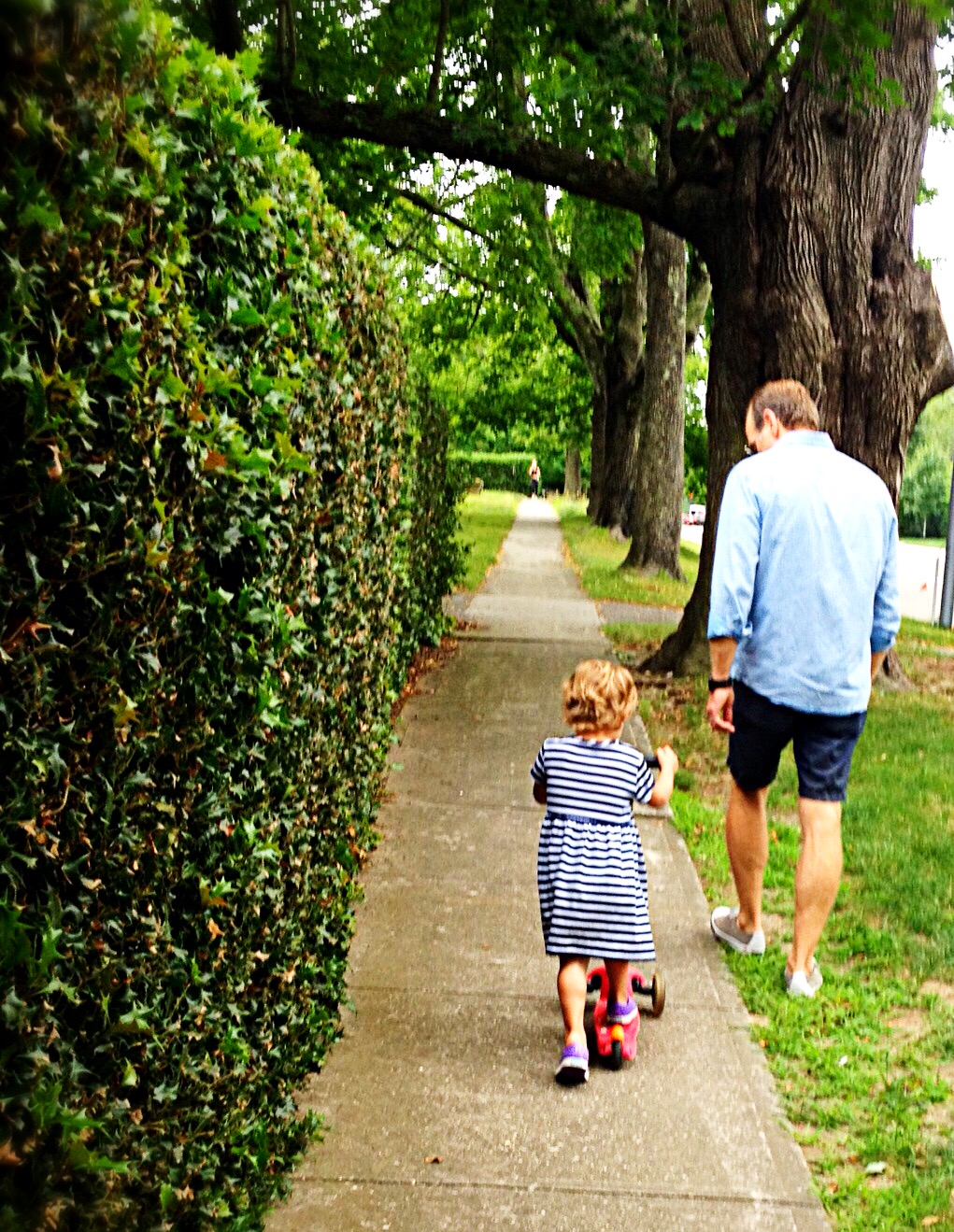 Photo of father and daughter enjoying a walk in Bridgehampton.