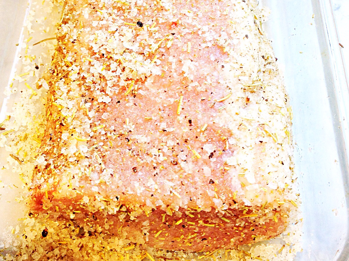 Photo of pork loin marinating in dry rub