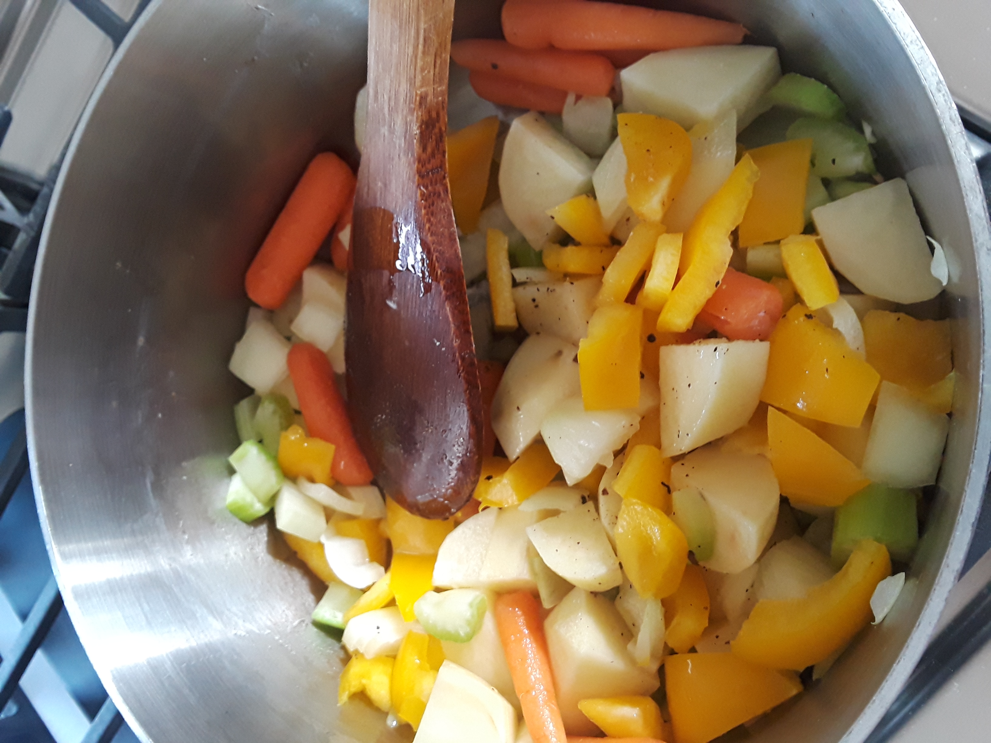 soup pot filled with sauteed veggies for chicken corn chowder