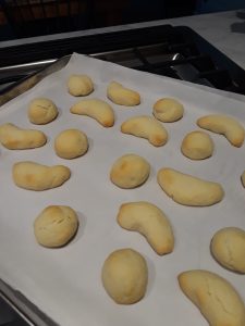 cookies shaped into balls and crescents