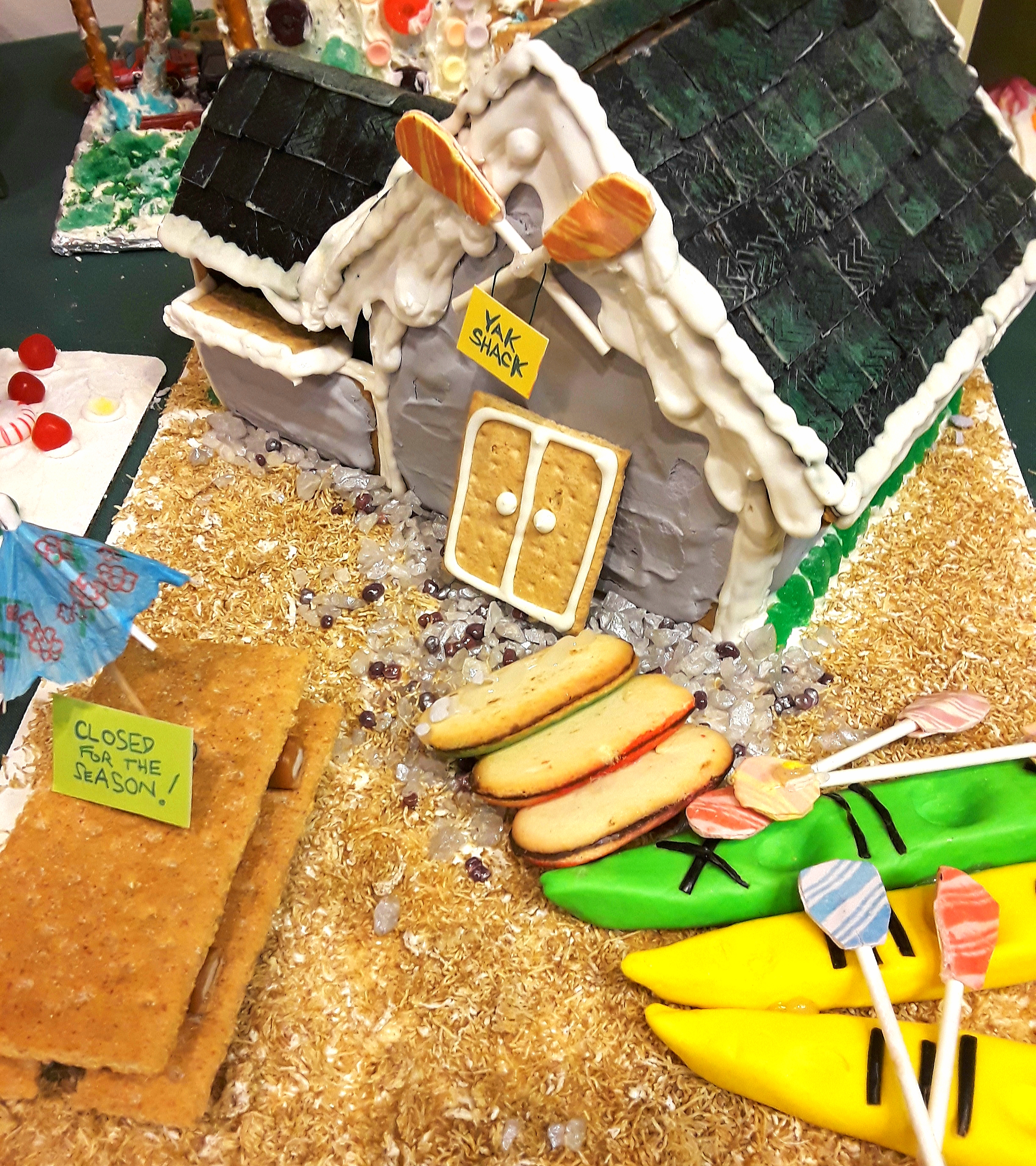 A gingerbread house decorated as a kayak rental center