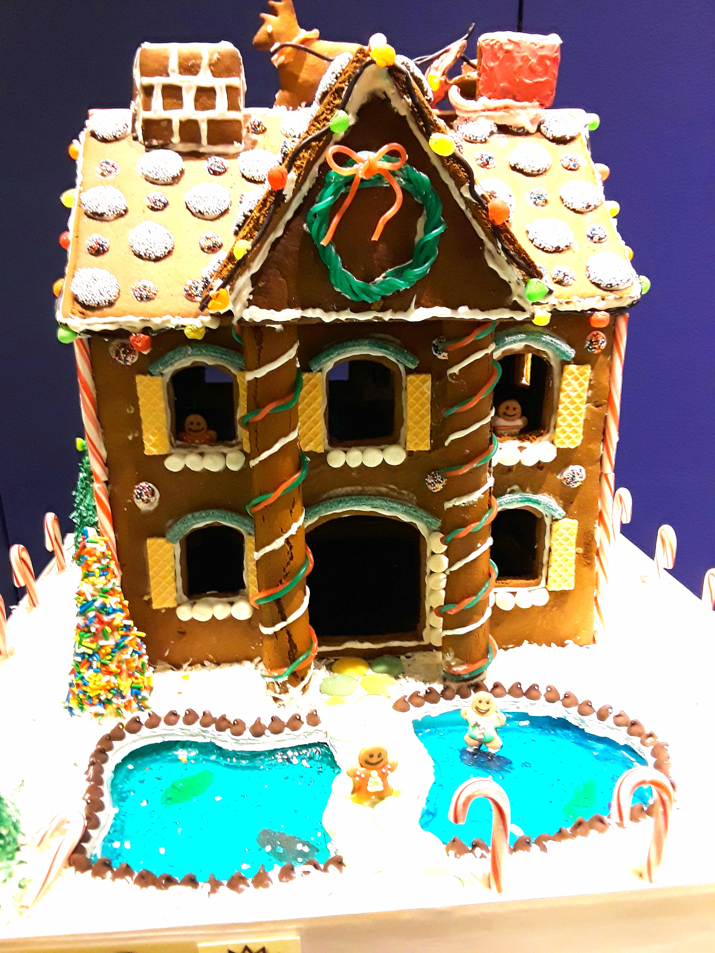 Two story gingerbread house with jelly front pond and vanilla wafer shutters