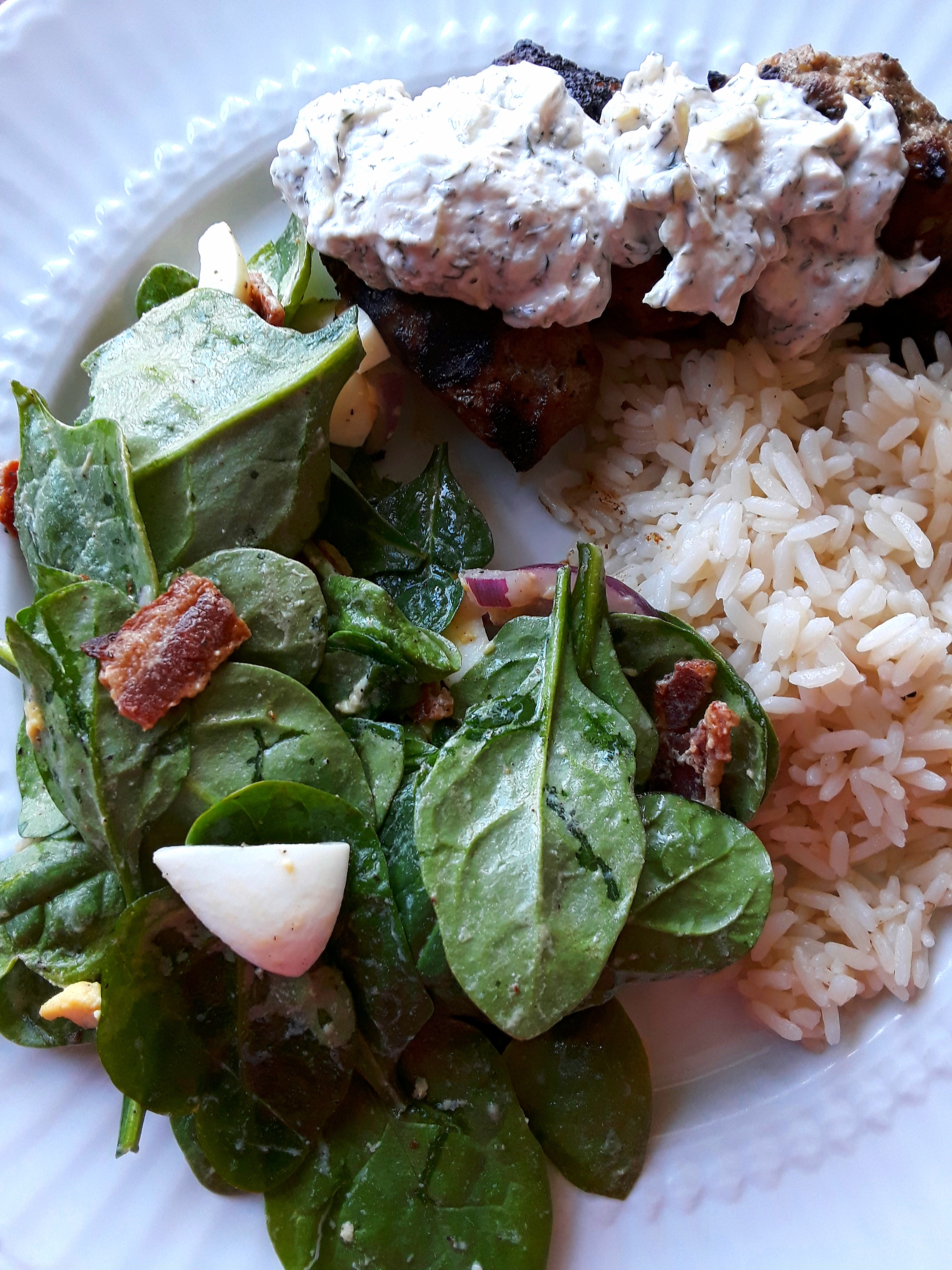 Lamb keftedes served with rice and spinach salad