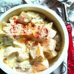 potato salad with sour cream and mayonnaise dressing, sprinkled with paprika