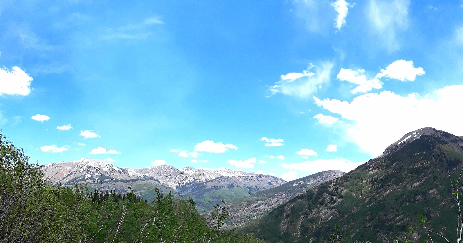 Various peaks are viewed from the pass, including Whitehouse Mountain and Daly.