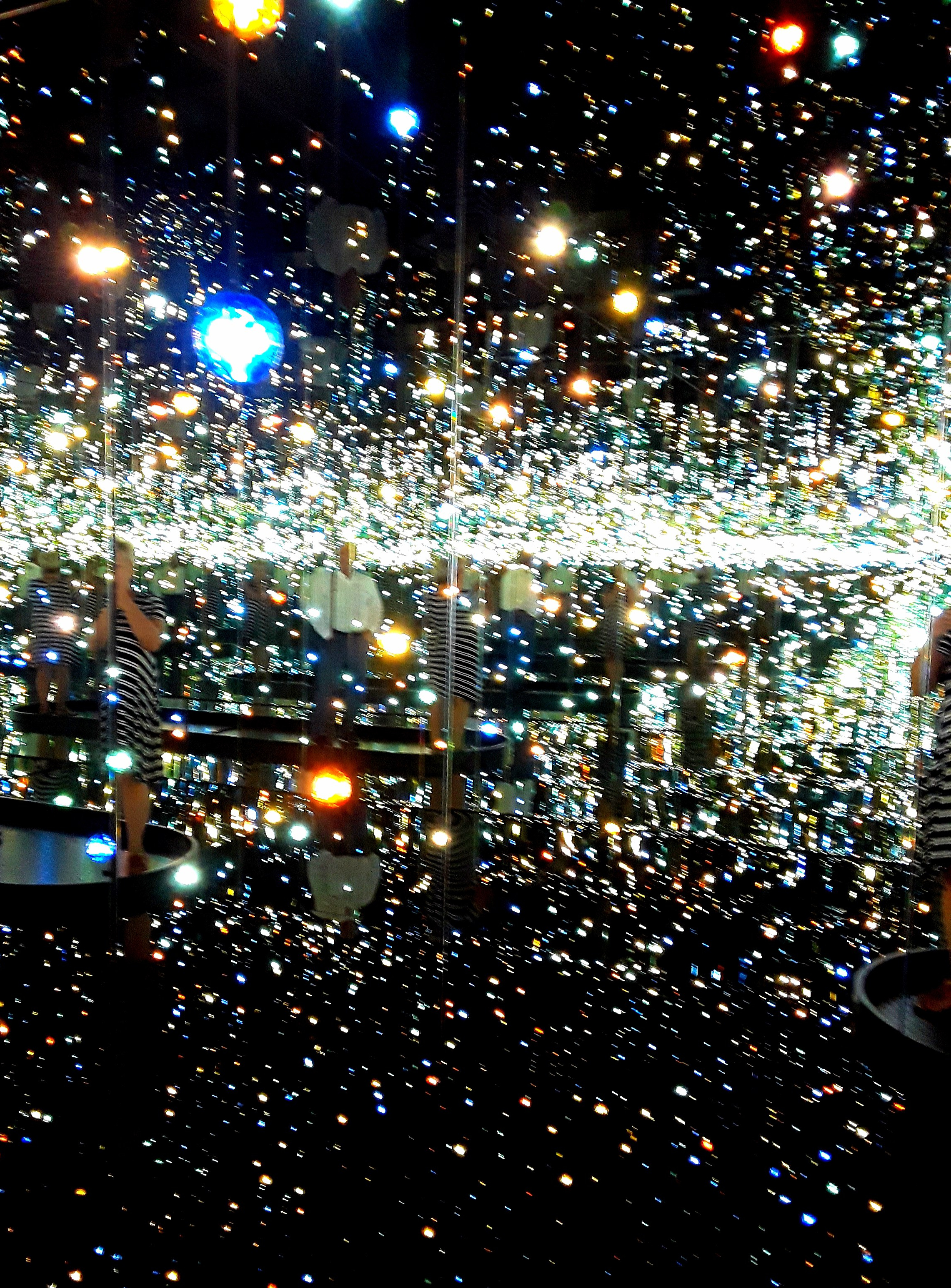 the lights and mirrors obliterate the images of the viewer
