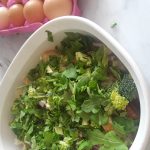 chopped greens are added to casserole dish