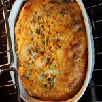 the baked casserole is golden brown and puffy