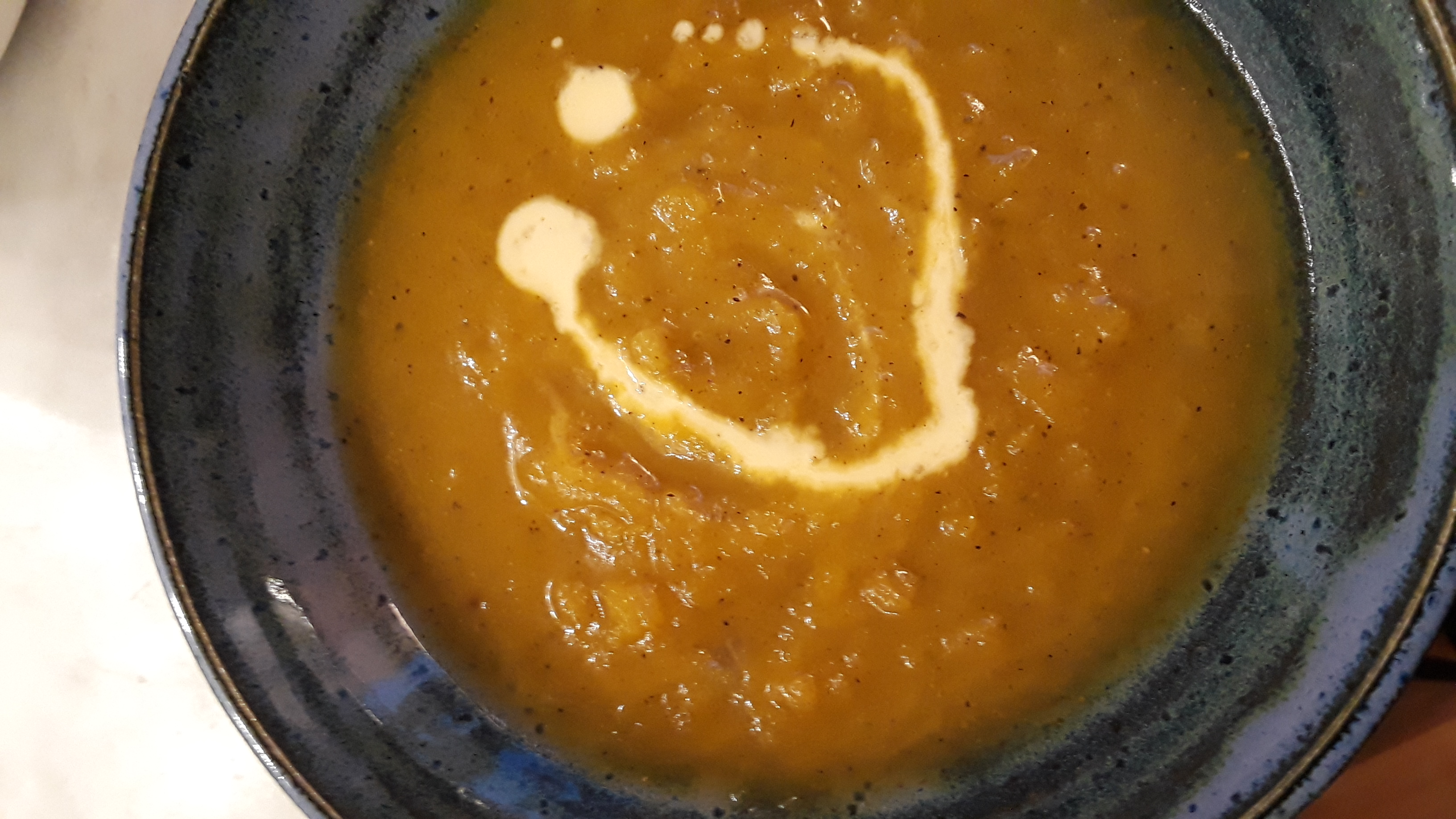 squash soup garnished with creme fraiche