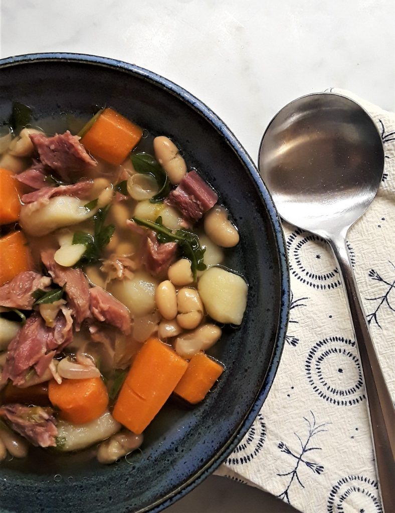 Chunks of ham add smoky flavor to ham and bean soup.