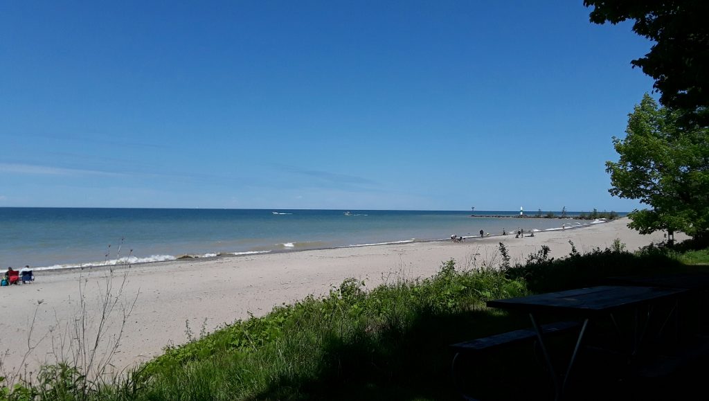 White sand and blue skies at the beach.