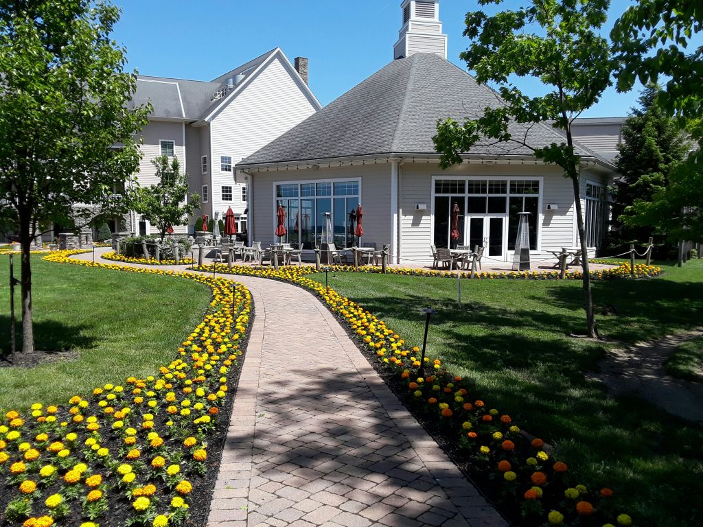 A path bordered with marigolds leads to the Inn.