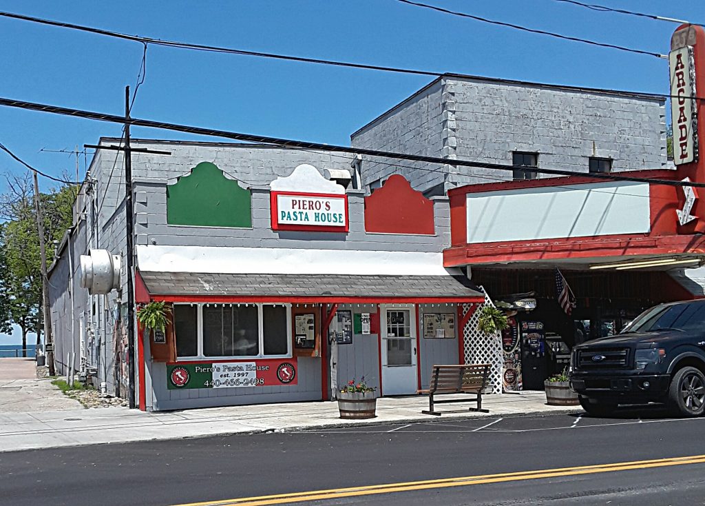 Pasta house building on The Strip is painted gray with red, white, and green signage.