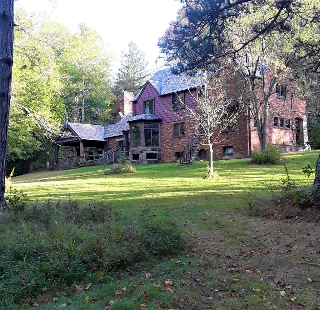 back of Amity House with lush lawn