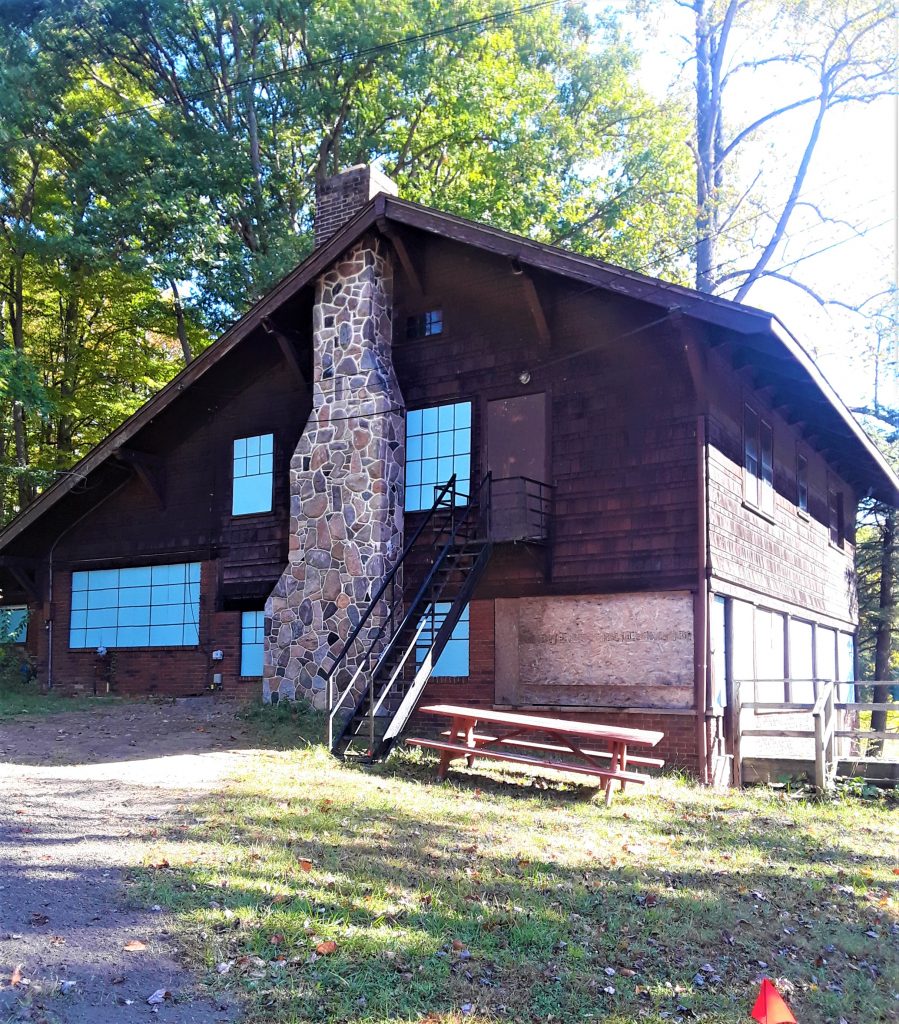 Kirby House sided in dark wood
