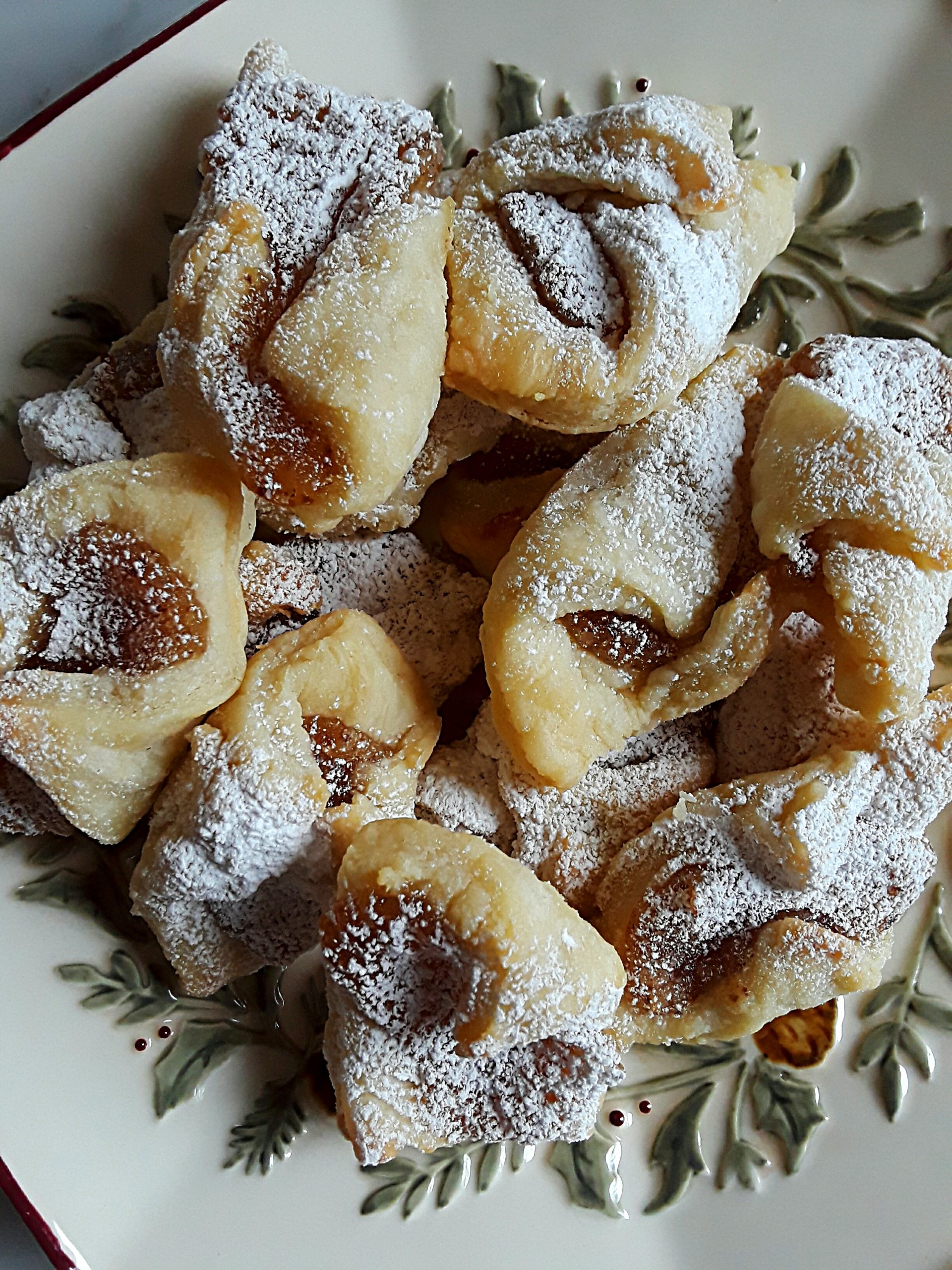 kolachki cookies are dusted with confectioner's sugar