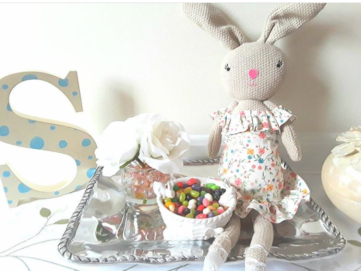 Easter vingette with bunny doll, jelly beans, white roses, and large wooden letter S