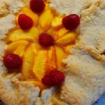 peach and raspberry galette is an open-faced pie