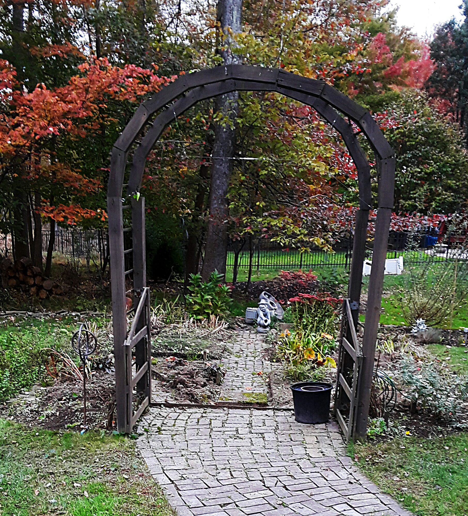 The arch remains, but the rest of the garden fence has been taken down.