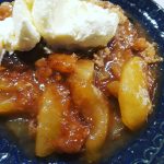 vanilla ice cream tops the apple slices