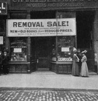 two women talk outside a bookstore, dressed in 1800's clothing